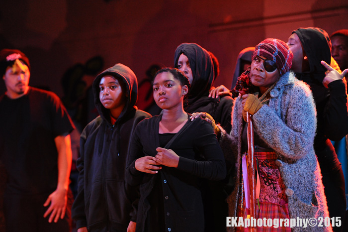 The "Greek chorus" raps, sings, and offers social commentary