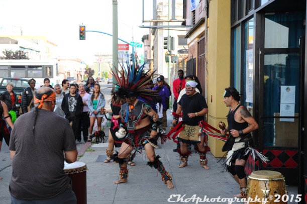 Aztec dancers outside La Cultura Cura Cafe