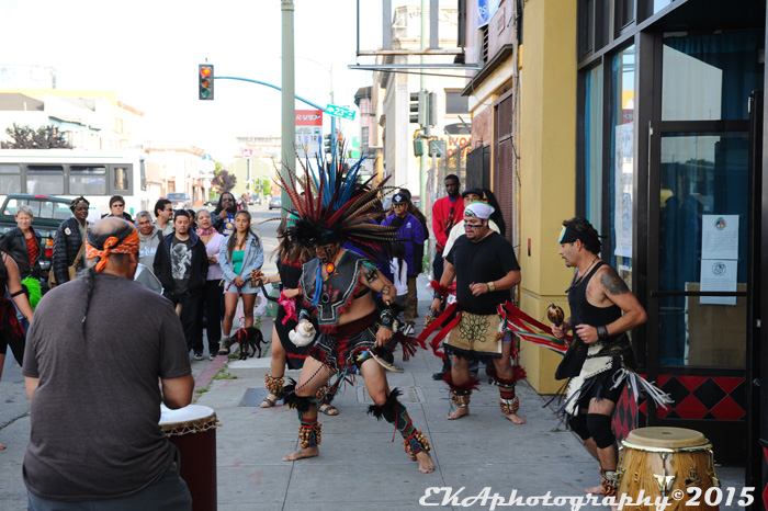 Aztec dancers outside La Cultura Cura Cafe